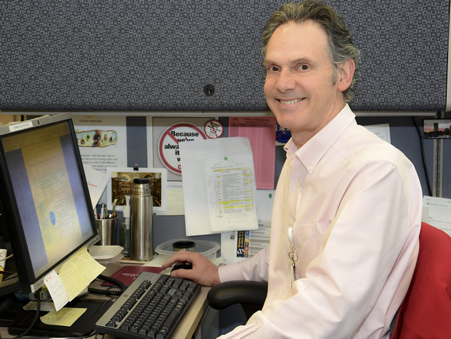 Librarian Ken Wright at his desk